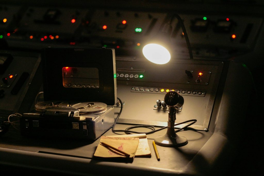 a desk with a light and a camera on it